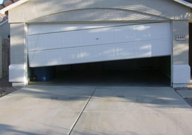 garage door off track repair in in Mission Hills